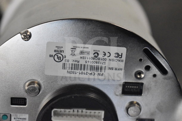 Bottom view of a security dome camera showing certification labels, serial number, made in Taiwan, and connection ports.