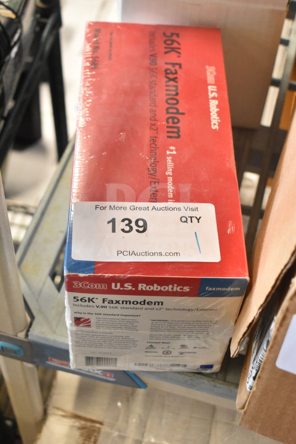 3Com 56K Faxmodem new in box, features V.90 standard, U.S. Robotics branding, sealed packaging. Auction lot 139 label.