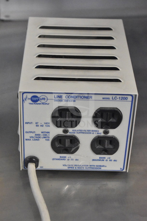Tripp Lite LC-1200 Line Conditioner, with four outlets, noise suppression, voltage regulation, in good condition.