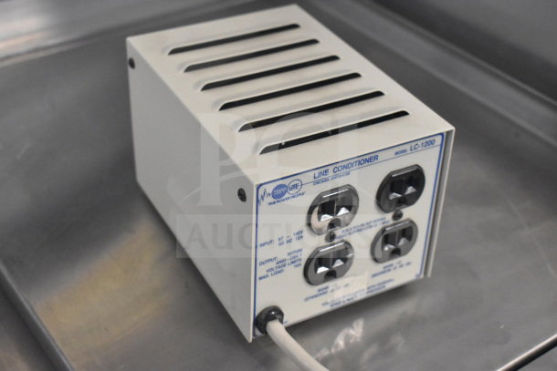 LC-1200 Line Conditioner, Tripp Lite brand, showing four outlets, input 87-140V, output 120V, good condition.