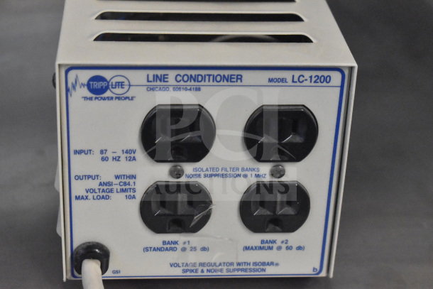 Tripp Lite LC-1200 Line Conditioner, 87-140V, 60Hz, 12A input, 10A max load. Voltage regulator with noise suppression.