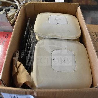 8 Cisco AIR-CAP3502I-A-K9 access points in a box, lightly used, with visible branding, ideal for network expansion.