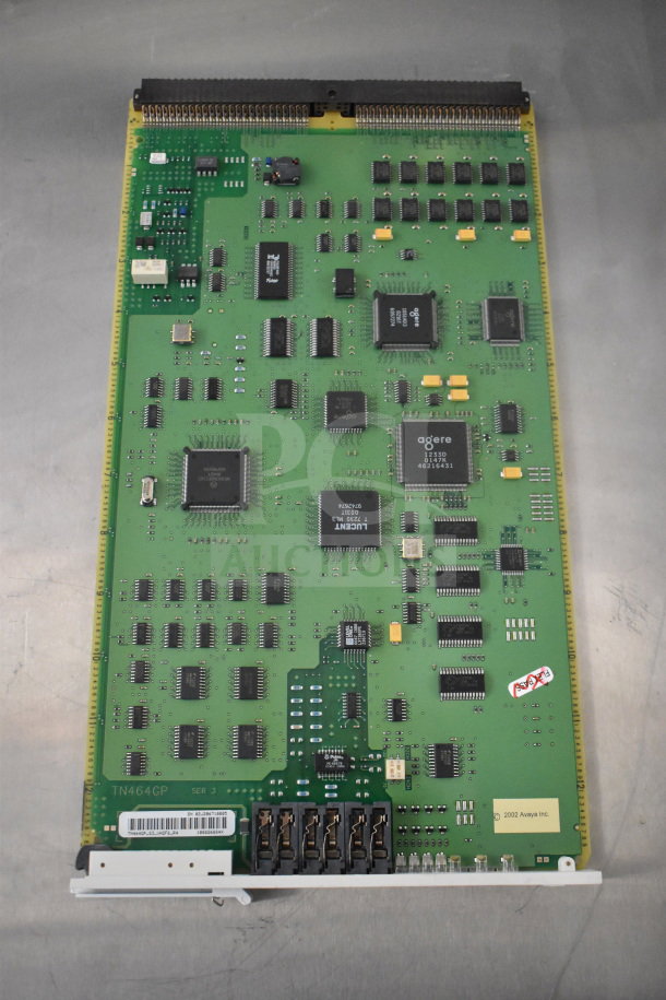 Avaya circuit board, model TN464GP, green with multiple chips, connectors, marked with "2002 Avaya Inc." in good condition.