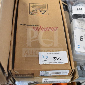Two Avaya circuit board boxes labeled with bid information and quantity, indicating auction item. Boxes appear in good condition.