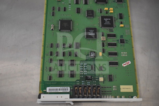 Avaya TN464GP circuit board, green, multiple chips, 2002 model, features connectors, labels with serial number.