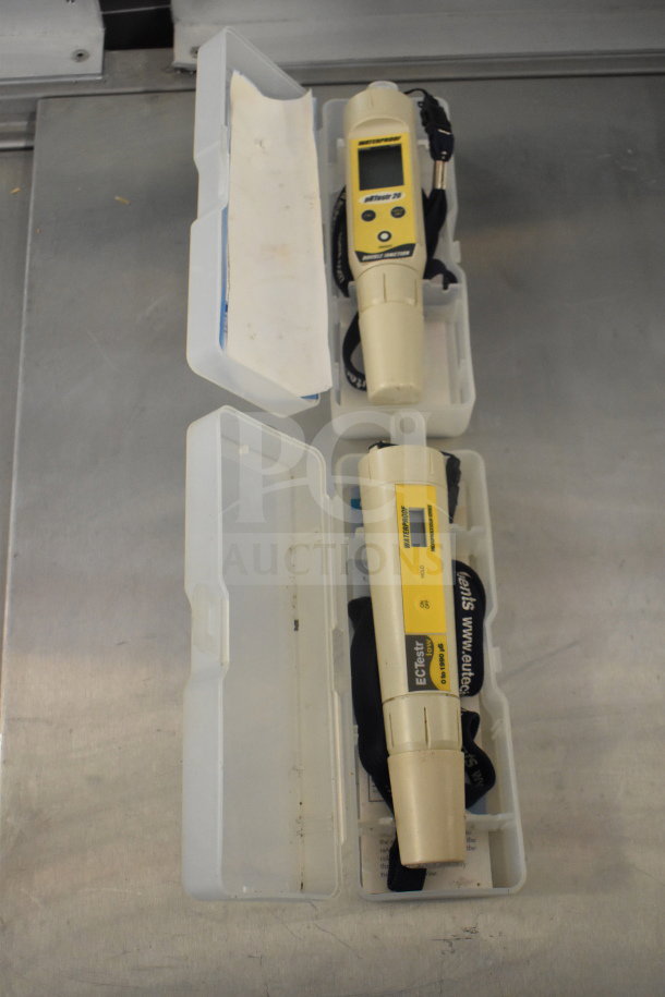 Two pRtestr 20 double junction meters in plastic cases, featuring microprocessor series, with visible labels for calibration and maintenance.