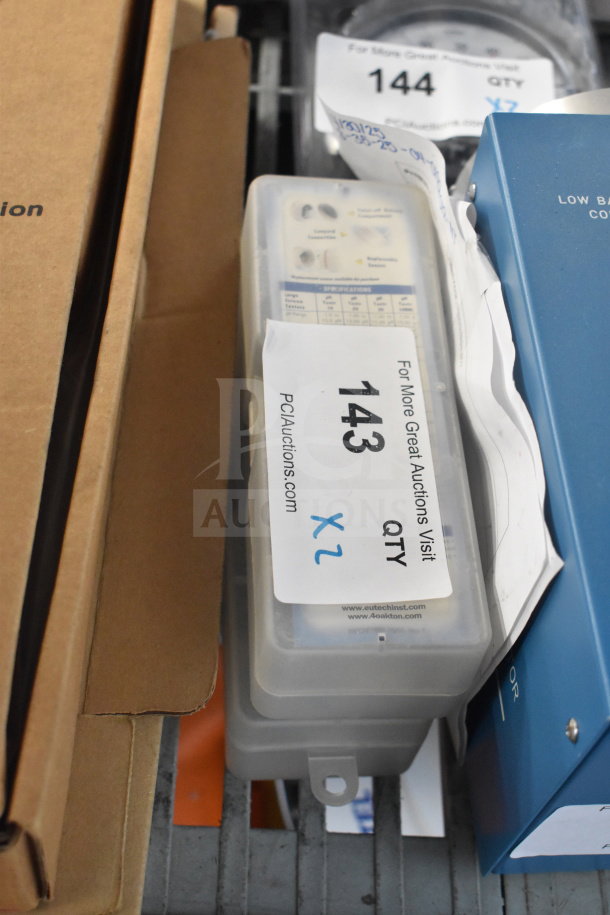 2 pRtestr 20 Double Junction ECTestr units in clear case, labeled "Qty 2." Includes specifications chart and auction tag 143.