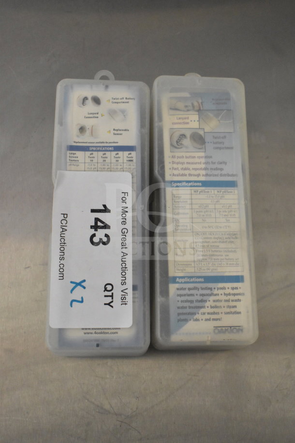 2 pRtestr 20 Double Junction / ECTestr devices in plastic cases; specifications and features visible; auction lot 143 tag.