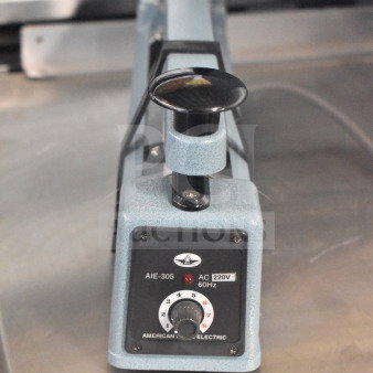 American International Electric AIE-305 Impulse Sealer, 220V, in good condition, with control dial and power markings visible.