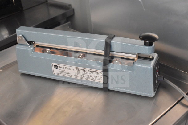 American International Electric AIE-305 Impulse Sealer, 220 Volts. Labels show model and operating instructions.