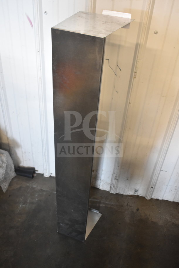 Silver metal piece for prep table lid, L-shaped and standing upright. Smooth surface with minor scuffs, no markings.