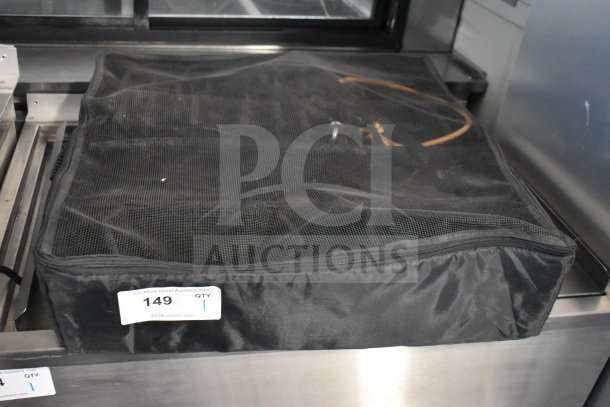 Black mesh bag with a zipper, placed on a metal surface. Auction tag reads "149, QTY 1, PCIAuctions.com."