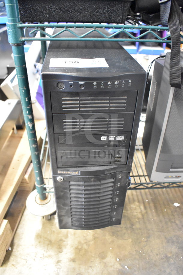 Supermicro computer tower with front panel controls, multiple drive bays, and visible label. Auction includes Toshiba MW14F51 monitor.
