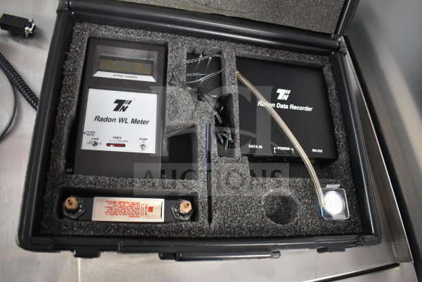 Radon Measurement System with Radon WL Meter and Data Recorder in foam case, includes cables and components.