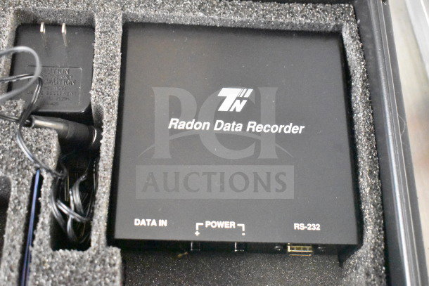Radon Measurement System with Radon WL Meter and Data Recorder in foam case. Features data in, power, RS-232 ports.