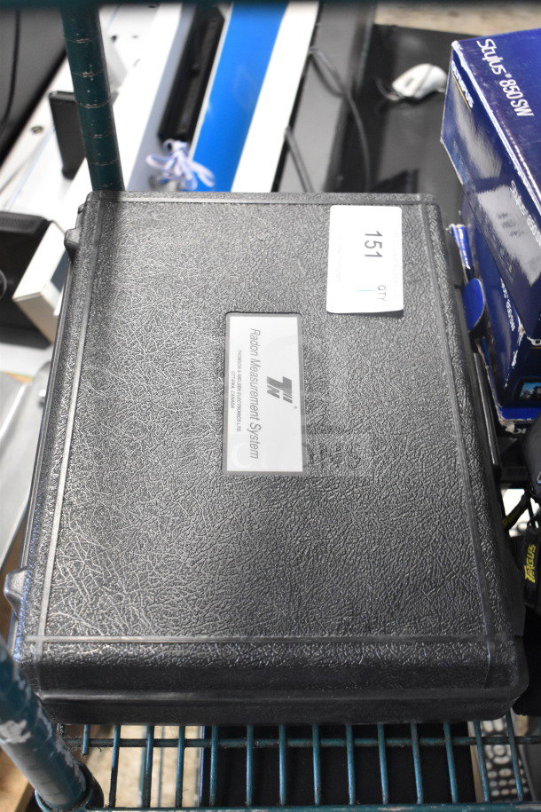 Black Radon Measurement System case with Radon WL Meter and Data Recorder; label reads "Radon Measurement System."