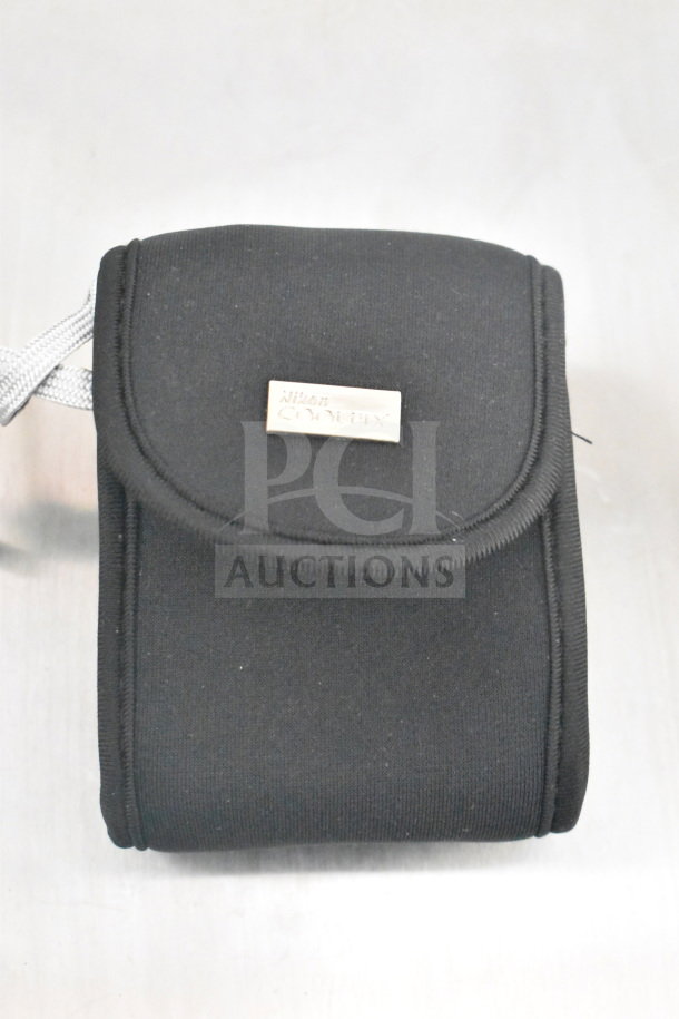 Black Nikon Coolpix camera bag with logo label, part of a set including 9 bags and 2 cameras, in good condition.