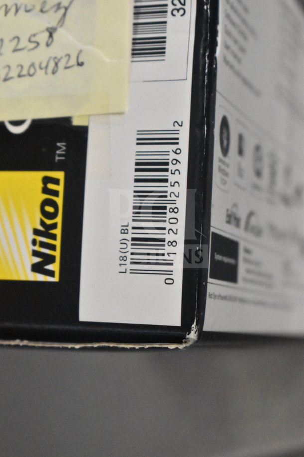 Nikon Coolpix L18 and L26 digital cameras in original box, visible model label L18(U)BL on box side.