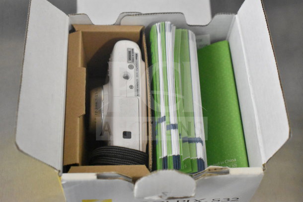 Two Coolpix S32 digital cameras in original box, pristine condition, includes manuals and accessories.