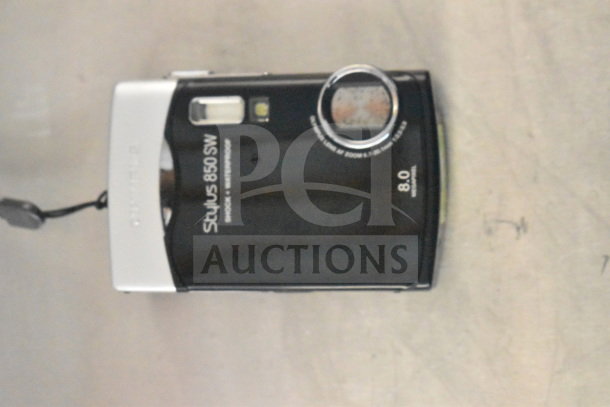 Olympus Stylus 850 SW digital camera, 8.0 MP, shock and waterproof, shown in original box.