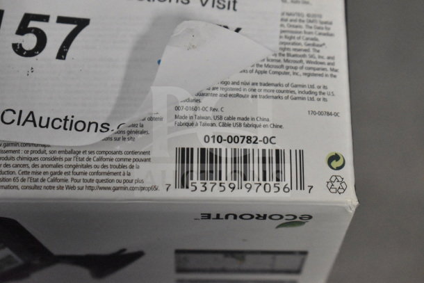 Garmin GPS in original box, includes Nuvi 1350 and Nuvi 1390 models. Barcode and recycling symbol visible.