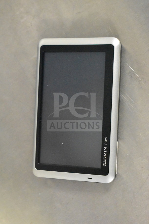 Garmin Nuvi 1350 GPS in original box, excellent condition, touchscreen display. Includes two additional units.
