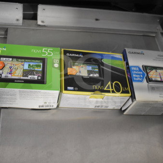 Three Garmin GPS units in original boxes: Nuvi 55 LM, Nuvi 40 LM, and Nuvi 1350 LM. Includes free lifetime maps.