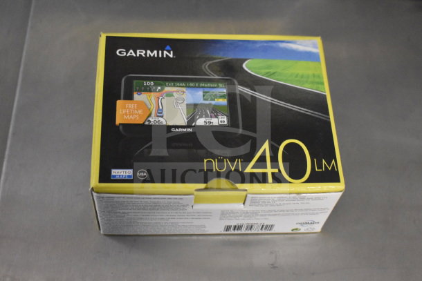 Garmin Nuvi 40 LM GPS in original box, offering free lifetime maps. Box features road imagery and Navteq Maps logo.