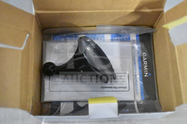 Original box with three Garmin GPS devices: Nuvi 55, Nuvi 40, and Nuvi 1350. Includes manuals and mount accessory.