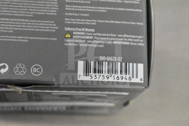 Garmin GPS in original box, warning labels, barcode visible; condition and value enhanced by packaging.