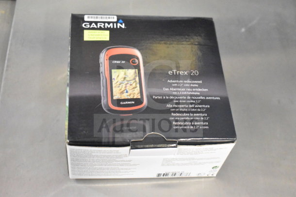 Garmin GPS bundle in original box, featuring eTrex Legend H, eTrex 20, and Nuvi 1390LMT. New condition, original labels.