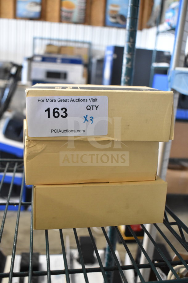Three APPS2Car GPS mounts in original boxes, new. Auction label shows quantity 3, lot 163, PCI Auctions.