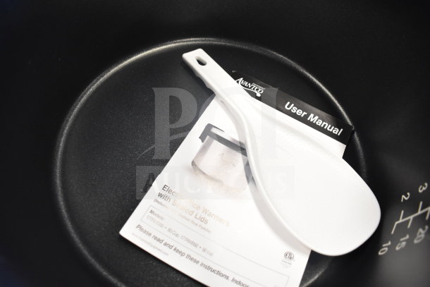 Avantco 177RWB60 rice warmer with user manual and rice paddle, 60 cup capacity, 120V, new with scratches and dents.
