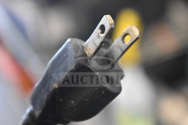 Close-up of a two-prong plug for Robot Coupe CL50 Series A Commercial Food Processor, showing slight wear.