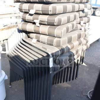 Stack of 17 black patio arm chairs with gray and black striped cushions, in good condition, labeled "17x."