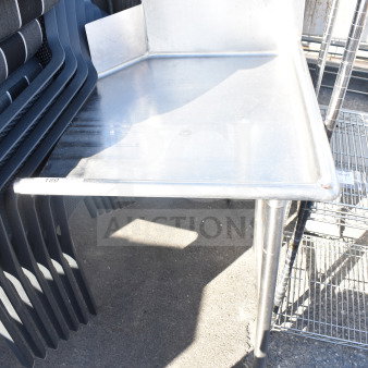 Commercial right side clean side dishwasher table, stainless steel, used. Features raised edging. Label visible.