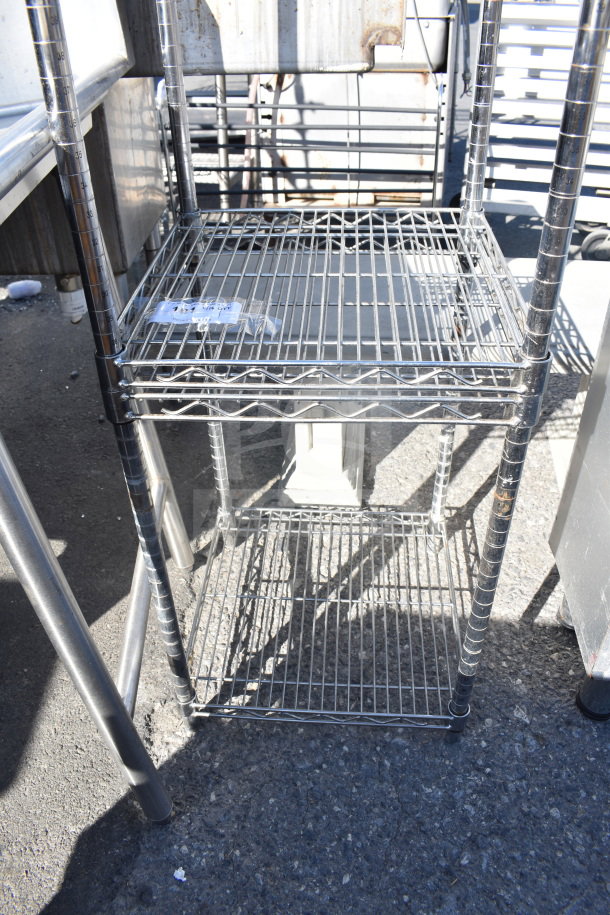 Chrome finish 3-tier shelving unit in good condition. Buyer must dismantle; additional freight charges may apply.