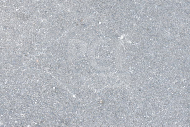 Concrete surface with a textured, gray finish. No visible items or markings.