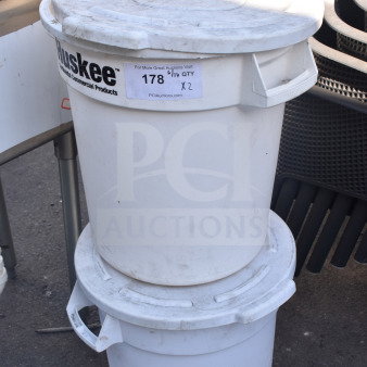 Two white Huskee poly trash cans with lids, showing signs of wear; labeled "178, Qty X2" for auction.