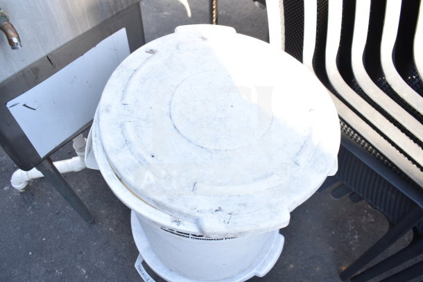 White poly trash can with lid, showing wear. Marked "Continental Commercial Products." Auction lot of two.