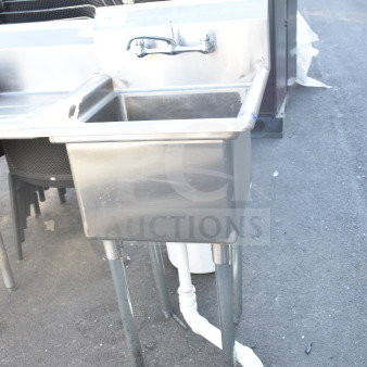 Stainless steel commercial single bay sink with faucet, displaying minimal wear, sturdy metal legs, visible plumbing beneath.
