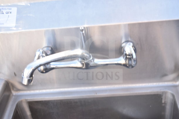 Commercial Single Bay Sink with stainless steel finish, mounted faucet. Slight wear; great for restaurant use.
