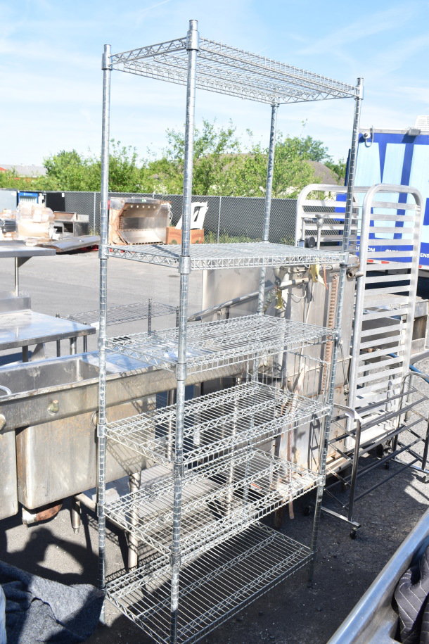 Chrome finish 6-tier wire shelving unit in good condition. Note: Buyer must dismantle and consider freight charges.