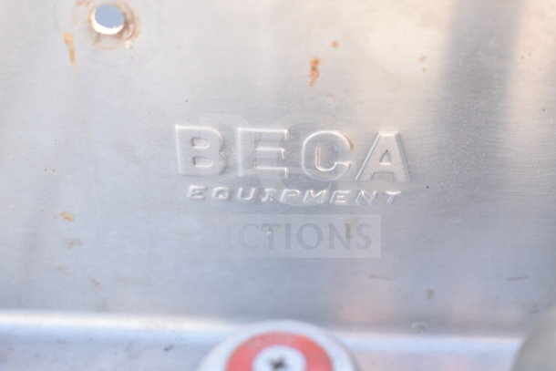 Rusty single bay sink with "BECA Equipment" embossed on metal surface, showing signs of wear.