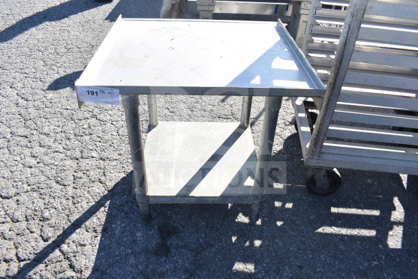 Commercial equipment stand with under shelf, metal, slightly worn, label marked "191". Ideal for kitchen use.