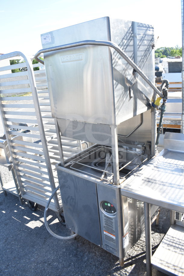 Hobart AM18 commercial pass-through dishwasher, 208-240V, 3 phase. Stainless steel exterior, control panel visible, used condition.