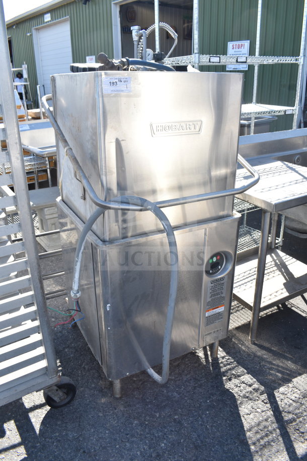 Hobart AM18 commercial dishwasher, straight pass-through, 208-240 volts, 3 phase, used condition with visible model tag.