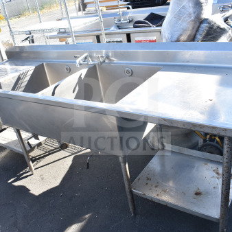 Commercial 2 bay stainless steel sink with dual drain boards, used condition, ideal for restaurant kitchens.