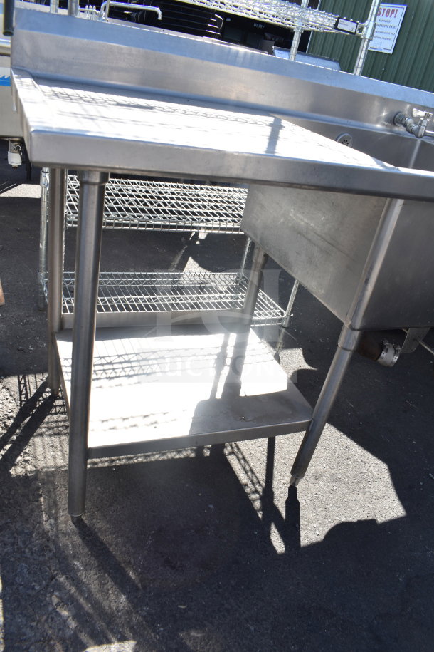 Commercial 2 bay sink with dual drain boards, stainless steel, sturdy condition, ideal for kitchen use.
