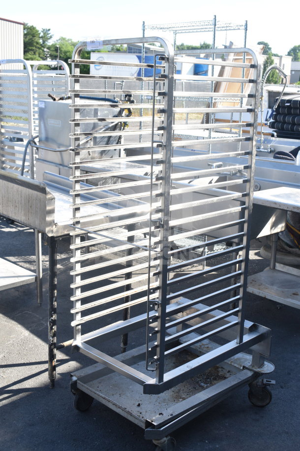 Commercial pan transport rack on casters, metal, roll-in oven compatible, excellent condition, multi-shelf design.